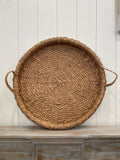 29 In round braided tray w/ handles